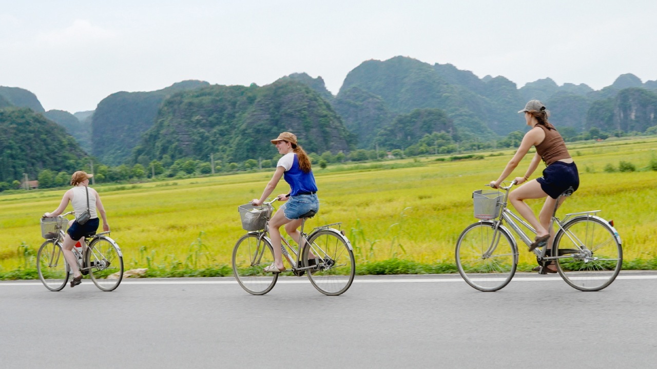 Guests riding bicycles through the Ninh Binh countryside